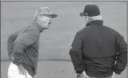  ?? NWA Democrat-Gazette/MICHAEL WOODS ?? Arkansas Coach Dave Van Horn argues with first-base umpire Darrell Arnold during the first inning of Saturday night’s game.