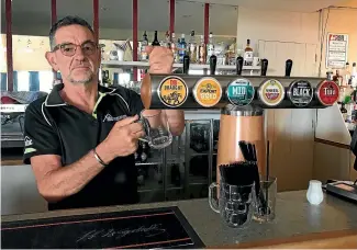  ??  ?? It’s last round for the South Canterbury RSA as president Greg Adams pours a drink before the venue closes for the final time.