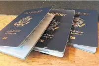  ?? CHRISTOPHE­R REYNOLDS TRIBUNE NEWS SERVICE FILE PHOTO ?? For some U.S. citizens, a second passport is a way to maintain some freedom of movement as lockdown measures tighten.