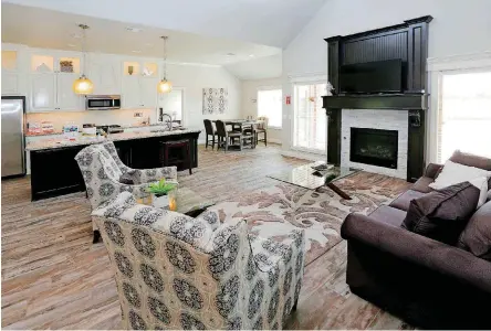  ?? [PHOTO BY PAUL HELLSTERN, THE OKLAHOMAN] ?? The open-space living-dining-kitchen area of the Homes by Taber model home at 2024 Sweetgrass Circle.