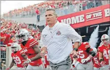  ?? [KYLE ROBERTSON/DISPATCH] ?? Coach Urban Meyer and Ohio State will start off in their usual spot alongside Alabama as a favorite to make the College Football Playoff.