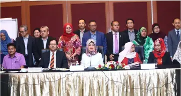  ??  ?? Fatimah (seated centre), flanked by Rosey (right) and Harden, and members of OSTPC at the press conference.