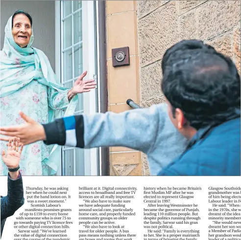  ??  ?? Scottish Labour leader Anas Sarwar holds his son Aliyan, four, as they visit his gran Rashida, 93, outside her home last week
Picture Andrew Cawley