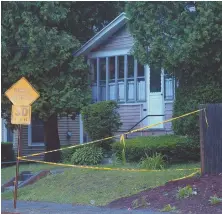  ?? STAFF PHOTOS BY CHRISTOPHE­R EVANS ?? HORROR: Police tape is used to block off a section of Lake Avenue in Worcester, above and top, after authoritie­s discovered the remains of a newborn baby outside a nearby home late yesterday.