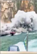  ?? ?? TUMBLING DOWN: Part of a rock wall collapses onto boats on a lake in southern Brazil on Saturday in an image from a video. The rock slide was blamed on heavy rains.