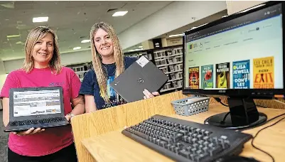  ?? BOB TYMCZYSZYN/ST. CATHARINES STANDARD ?? Becky Dixon, manager of operations at Niagara Falls Public Library, left, and Holly Jones, manager of programmin­g and promotions at St. Catharines Public Library, at the Victoria Avenue branch in Niagara Falls.