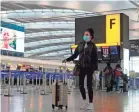  ?? NIKLAS HALLE’N/AFP VIA GETTY IMAGES ?? Travelers from Heathrow Airport in London and other U.K. sites have new bans to contend with as nations try to keep a recently emerged virus variant at bay.