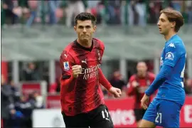  ?? LUCA BRUNO - THE ASSOCIATED PRESS ?? Christian Pulisic celebrates after scoring his side’s opening goal during a Serie Ar match between AC Milan and Empoli at the San Siro stadium in Milan, Italy, Sunday.