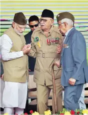 ?? PHOTO: PTI ?? PM Narendra Modi with INA Veteran Lalti Ram during a flag hoisting ceremony to mark the 75th anniversar­y of the ‘Azad Hind government’ at Red Fort on Sunday
