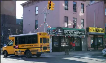  ?? PHOTOS BY BRITTAINY NEWMAN — THE NEW YORK TIMES ?? This smoke shop sits down the block from Alfred E. Smith High School in the Bronx.