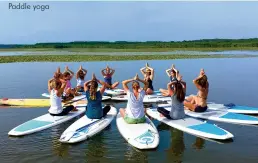  ??  ?? Paddle yoga