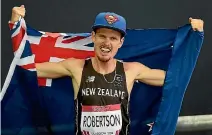  ?? PHOTOSPORT ?? New Zealand’s Zane Robertson after winning the bronze medal in the men’s 5000 metre final at the 2014 Commonweal­th Games.