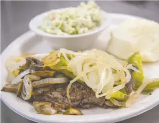  ??  ?? Fresh ground beef, hand-patted, is used for hamburger steaks at Dari Dip. Grilled peppers, onions and mushrooms can be added for a small surcharge.