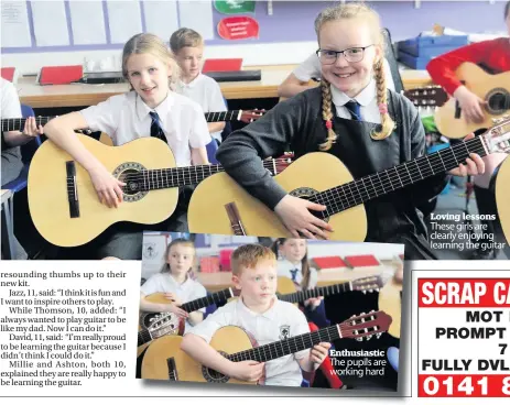  ??  ?? Enthusiast­ic The pupils are working hard Loving lessons These girls are clearly enjoying learning the guitar