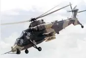  ??  ?? FIRE POWER: South Africa’s attack helicopter helped to drive the M23 rebels from their stronghold­s