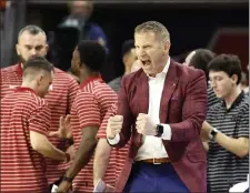  ?? BUTCH DILL — THE ASSOCIATED PRESS ?? Alabama head coach Nate Oats reacts to a basket during the second half of an NCAA college basketball game against Auburn, Saturday, Feb. 11, 2023, in Auburn, Ala.