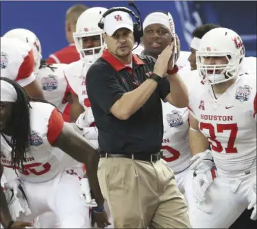  ?? JOHN BAZEMORE — THE ASSOCIATED PRESS FILE ?? In this file photo, Houston head coach Tom Herman watches play against Florida State during the first half of the Peach Bowl NCAA college football game in Atlanta. He has been hired as the head coach for Texas.