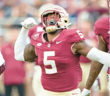  ?? MICHAEL CHANG/GETTY ?? Florida State defensive end Jared Verse celebrates after a big play against Virginia Tech.