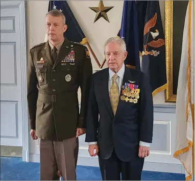  ?? BILL RETTEW — MEDIANEWS GROUP ?? Four Star Gen. Daniel R. Hokanson, left, presents the Silver Star to helicopter pilot Lawrence Liss.