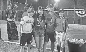  ?? COURTESY OF THE ANTOLIK FAMILY ?? Dana Yoo, center left, poses, left to right, with her son Caius, husband Chris and son Marcus at a tournament in Cooperstow­n, New York, during the summer of 2022.