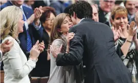  ?? SEAN KILPATRICK, CP ?? Prime Minister Justin Trudeau hugs Rona Ambrose in the House of Commons on Tuesday after the interim Conservati­ve leader made it official that she will resign her seat in June when MPs break for summer, in preparatio­n for a new life in the private...