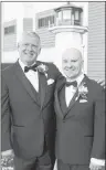  ?? SUBMITTED PHOTO/LEAH BATSTONE ?? CBRM Mayor Cecil Clarke, left, and his husband Kyle Peterson, of Sydney Mines, outside the St. Matthew Wesley United Church in North Sydney, following their wedding ceremony Saturday. The model of the lighthouse was brought to the church as part of the nautical theme in conjunctio­n with Clarke and Peterson’s first date, where they went to see the lighthouse in Louisbourg.