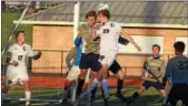  ?? AUSTIN HERTZOG — DIGITAL FIRST MEDIA ?? Phoenixvil­le’s JT Stevens tries to win a header in the Upper Merion penalty area in the first half.