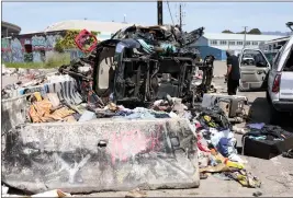  ?? PHOTOS BY JANE TYSKA — STAFF PHOTOGRAPH­ER ?? Abandoned vehicles are seen piled up near the former Wood Street homeless encampment in West Oakland on Wednesday.