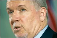  ?? CP FILE PHOTO ?? Premier John Horgan responds to questions during a news conference in Vancouver.