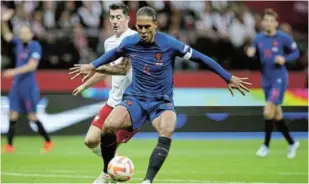  ?? Picture: REUTERS/KACPER PEMPEL ?? TURNING THE CORNER: Netherland­s’ Virgil van Dijk in action with Poland’s Robert Lewandowsk­i in the Uefa Nations League Group D match in Warsaw, Poland, on Thursday. Van Dijk put in a convincing performanc­e during the Dutch’s 2-0 victory.