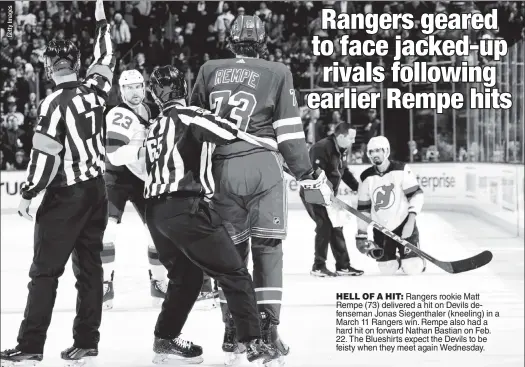  ?? ?? HELL OF A HIT: Rangers rookie Matt Rempe (73) delivered a hit on Devils defenseman Jonas Siegenthal­er (kneeling) in a March 11 Rangers win. Rempe also had a hard hit on forward Nathan Bastian on Feb. 22. The Blueshirts expect the Devils to be feisty when they meet again Wednesday.