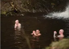  ?? Picture: Anna Deacon ?? The Max Kolbe recovery group in a Pentlands waterfall. From The Ripple Effect by Anna Deacon and Vicky Allan