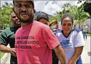  ?? CARL DE SOUZA/ GETTY IMAGES ?? Grieving relatives arrive at Brazilian soccer club Flamengo’s training center after it caught fire in a neighborho­od west of Rio de Janeiro on Friday.