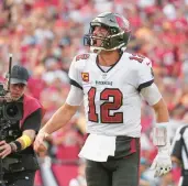  ?? PETER JONELEIT/AP ?? Buccaneers quarterbac­k Tom Brady celebrates after his rushing touchdown Sunday in Tampa, Fla.