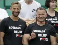  ?? PETR DAVID JOSEK — THE ASSOCIATED PRESS ?? Petra Kvitova’s coach Jiri Vanek, left, and another staff member support Kvitova.