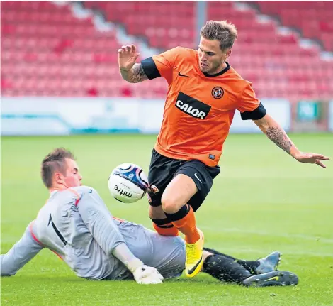  ?? SNS ?? Ryan Scully prevents a scoring chance for Dundee United’s David Goodwillie in a pre-season friendly in 2013.