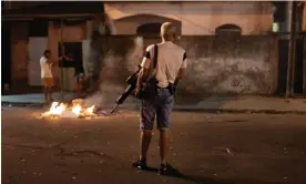  ?? ?? This year’s presidenti­al election has pitted Brazilians, including Rio’s gangsters, against each other like never before. Photograph: Alan Lima.