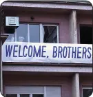  ??  ?? RESPECT: Banners draped from flats in Pristina greet England