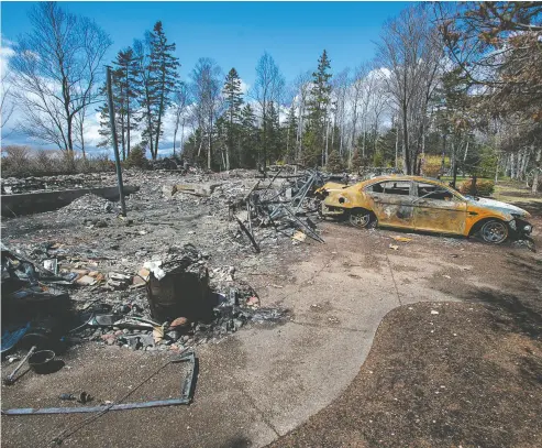  ?? Andrew Vaughan
/ The Cana dian Press ?? A fire- destroyed property registered to Gabriel Wortman in Portapique, N. S. An acquaintan­ce has described
Wortman to police as “a sociopath, abusive. Another said he was “controllin­g and paranoid.”