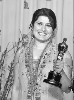  ??  ?? Chinoy pose with her Oscars during the 84th Academy Awards in Hollywood, California on Feb 26, 2012. — Reuters file photo