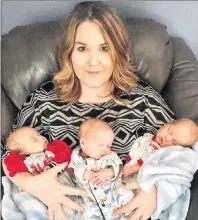  ?? THE CANADIAN PRESS/HAYLEY ARSENAULT ?? Hayley Arsenault of Tignish, P.E.I. holds her triplet boys, Hogan, Rylan and Finn in this undated handout photo.