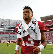  ?? KEVIN C. COX / GETTY IMAGES/TNS ?? Tua Tagovailoa, formerly of Alabama, pronounced himself 100% healthy last week during an interview on ESPN.