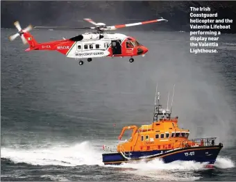  ??  ?? The Irish Coastguard helicopter and the Valentia Lifeboat performing a display near the Valentia Lighthouse.