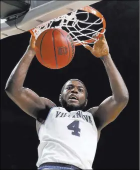  ?? David J. Phillip The Associated Press ?? Villanova shot 55.4 percent, including Eric Paschall’s second-half dunk, to dispose of Kansas in their Final Four clash on Saturday.