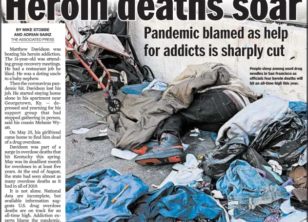  ??  ?? People sleep among used drug needles in San Francisco as officials fear heroin deaths will hit an all-time high this year.