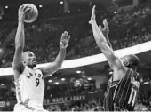  ?? FRANK GUNN/ASSOCIATED PRESS ?? Raptors F Serge Ibaka (9) puts up a shot over Magic C Bismack Biyombo during Monday’s game in Toronto.