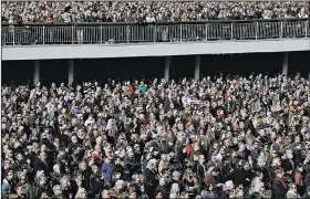  ?? AP/MARKUS SCHREIBER ?? Thousands of Swedes attend a “Lovefest” vigil against terrorism in central Stockholm on Sunday.