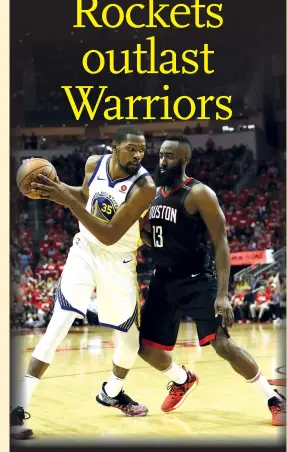  ??  ?? Kevin Durant (left) of the Golden State Warriors drives against James Harden of the Houston Rockets in the third quarter of Game Five of the Western Conference Finals of the 2018 NBA Playoffs at Toyota Center on Thursday in Houston, Texas.