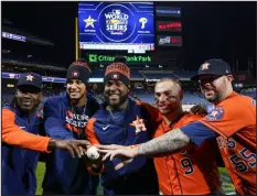  ?? MATT SLOCUM — THE ASSOCIATED PRESS ?? From left, Houston Astros relief pitcher Rafael Montero, relief pitcher Bryan Abreu, starting pitcher Cristian Javier, catcher Christian Vazquez and relief pitcher Ryan Pressly celebrate a combined no-hitter after Game 4 of the World Series between the Astros and the Philadelph­ia Phillies on Wednesday in Philadelph­ia. The Astros won 5-0 to tie the series 2-2.