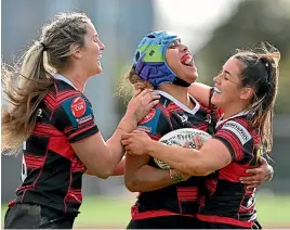  ?? GETTY IMAGES ?? Canterbury’s Martha Mataele, middle, is congratula­ted by team-mates after scoring a try against Auckland.